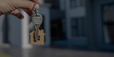 A hand holding keys to a Scottsdale home for sale